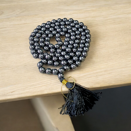 A Magnet Mala made with 108+1 smooth, round 8mm magnetic beads, neatly strung for healing, meditation, or spiritual wear