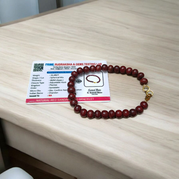 A Natural Red Sandalwood (Lal Chandan) Bracelet with 8mm polished beads, strung on stretchable thread, ideal for meditation and spiritual practice