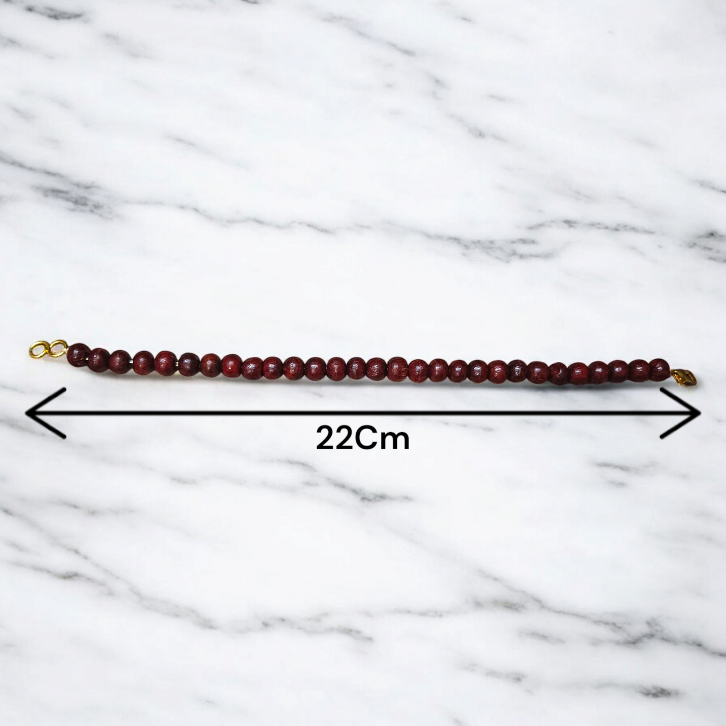 A Natural Red Sandalwood (Lal Chandan) Bracelet with 8mm polished beads, strung on stretchable thread, ideal for meditation and spiritual practice