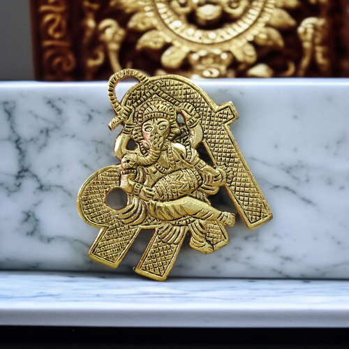 A beautifully crafted brass wall hanging of Lord Ganesha in 11×11 cm size, ideal for temple, home entrance, or office wall décor