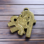 A beautifully crafted brass wall hanging of Lord Ganesha in 11×11 cm size, ideal for temple, home entrance, or office wall décor
