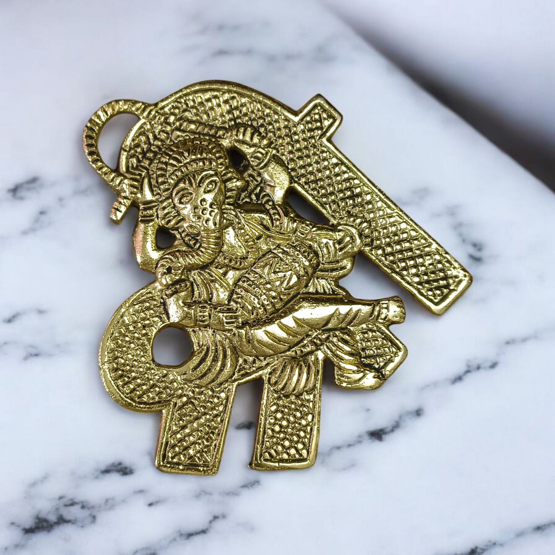 A beautifully crafted brass wall hanging of Lord Ganesha in 11×11 cm size, ideal for temple, home entrance, or office wall décor