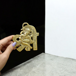 A beautifully crafted brass wall hanging of Lord Ganesha in 11×11 cm size, ideal for temple, home entrance, or office wall décor
