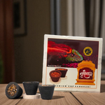A box of MALAWALA Premium Cup Sambrani containing 12 natural dhoop cups arranged neatly, with one cup lit and emitting aromatic smoke