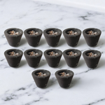 A box of MALAWALA Premium Cup Sambrani containing 12 natural dhoop cups arranged neatly, with one cup lit and emitting aromatic smoke