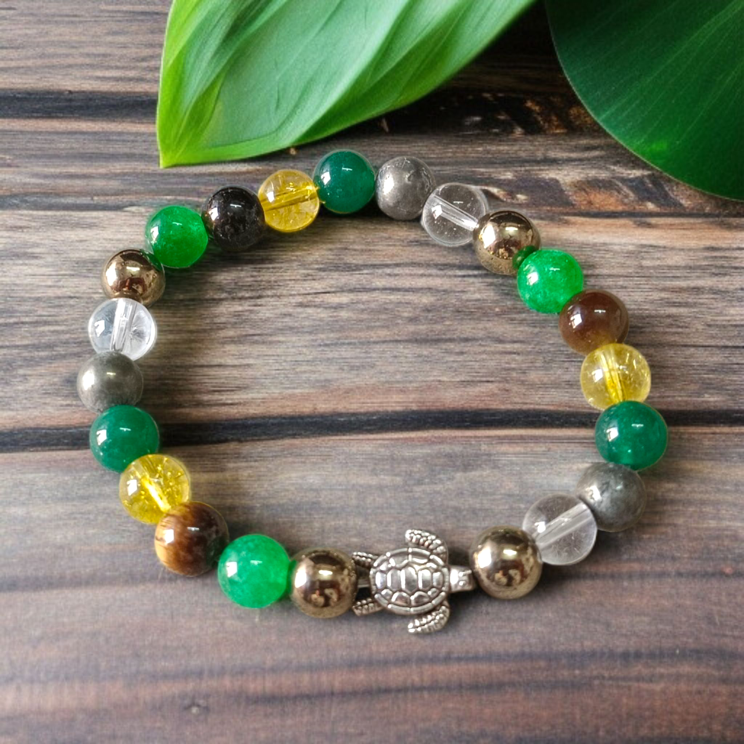 A handcrafted 8mm beaded Money Magnet Bracelet by MALAWALA featuring natural gemstone beads, designed to attract wealth and prosperity, displayed on a neutral background