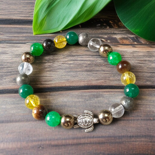 A handcrafted 8mm beaded Money Magnet Bracelet by MALAWALA featuring natural gemstone beads, designed to attract wealth and prosperity, displayed on a neutral background