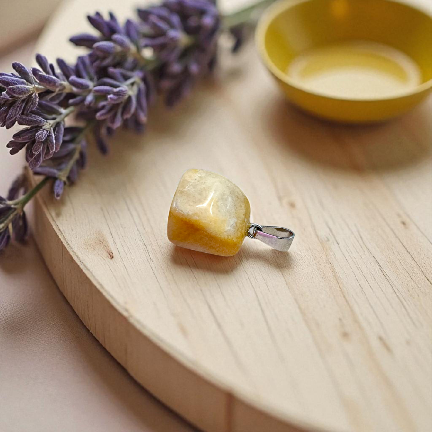 A handcrafted Yellow Aventurine stone pendant with a polished oval gemstone set in a sleek metal frame, suitable for men and women