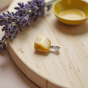 A handcrafted Yellow Aventurine stone pendant with a polished oval gemstone set in a sleek metal frame, suitable for men and women