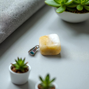 A handcrafted Yellow Aventurine stone pendant with a polished oval gemstone set in a sleek metal frame, suitable for men and women