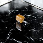 A handcrafted Yellow Aventurine stone pendant with a polished oval gemstone set in a sleek metal frame, suitable for men and women