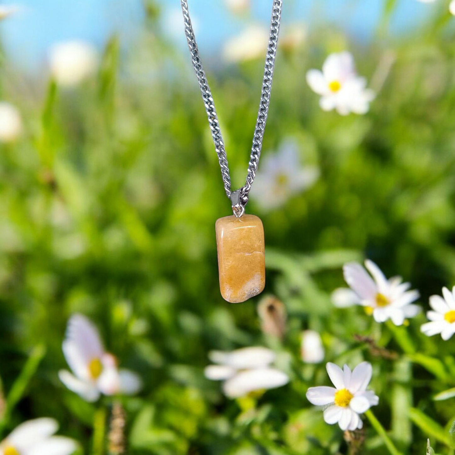 A handcrafted Yellow Aventurine stone pendant with a polished oval gemstone set in a sleek metal frame, suitable for men and women