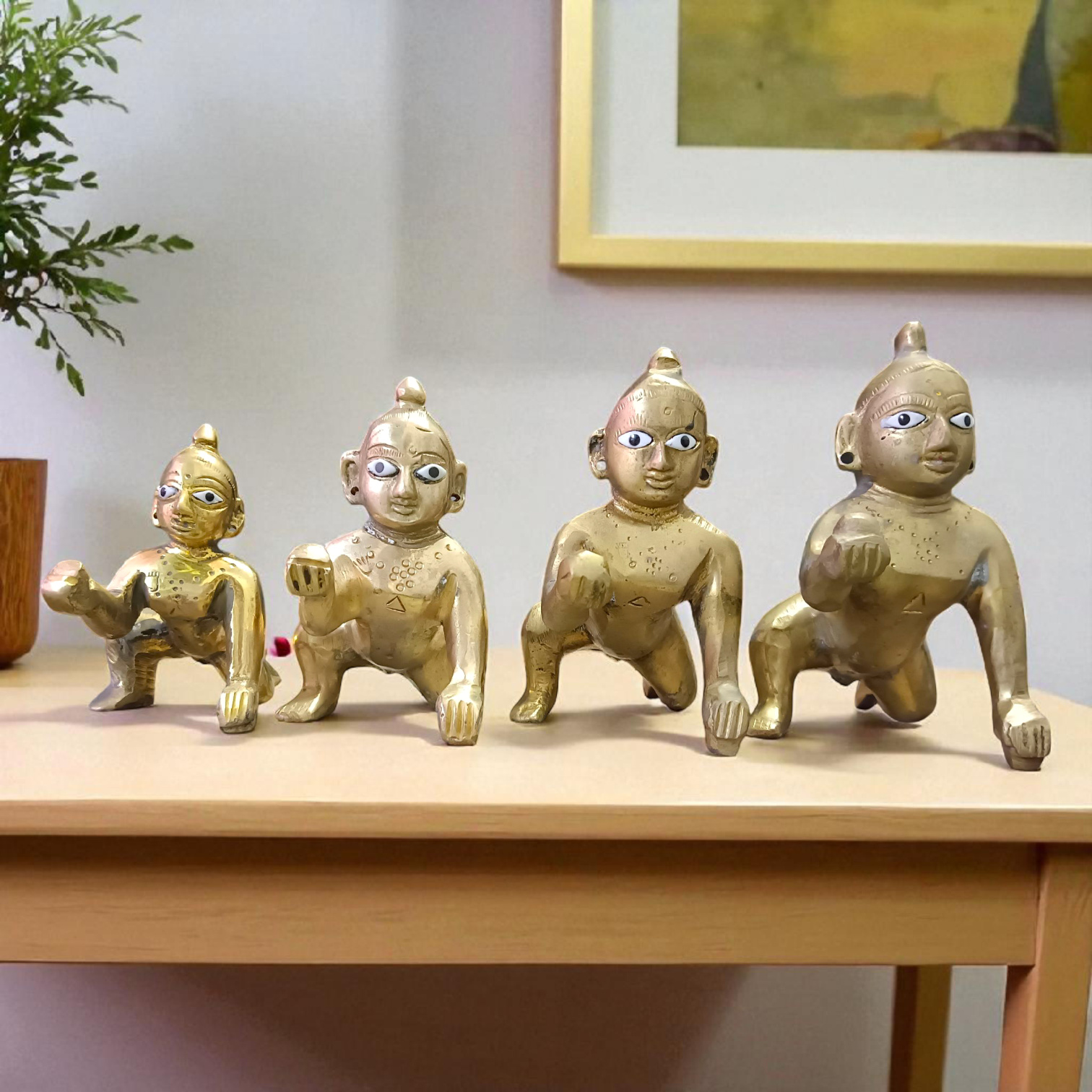 A handcrafted brass Laddu Gopal statue in crawling pose, available in sizes 0 to 6, ideal for temple and home worship
