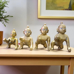 A handcrafted brass Laddu Gopal statue in crawling pose, available in sizes 0 to 6, ideal for temple and home worship