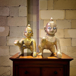 A handcrafted brass Laddu Gopal statue in crawling pose, available in sizes 0 to 6, ideal for temple and home worship