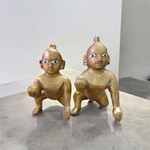A handcrafted brass Laddu Gopal statue in crawling pose, available in sizes 0 to 6, ideal for temple and home worship