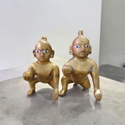 A handcrafted brass Laddu Gopal statue in crawling pose, available in sizes 0 to 6, ideal for temple and home worship