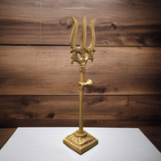 A handcrafted brass Trishul with Damru symbolizing Lord Shiva, ideal for home décor, temple altar, or spiritual gifting