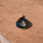 A lab-certified Natural Sulemani Pendant with a polished black agate stone set in sterling silver, displayed on a clean white background