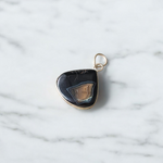 A lab-certified Natural Sulemani Pendant with a polished black agate stone set in sterling silver, displayed on a clean white background 