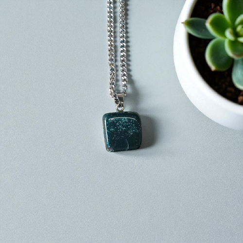 A natural Green Aventurine (African Green Jade) pendant with a polished finish, attached to a metal chain—ideal for men and women’s spiritual wear