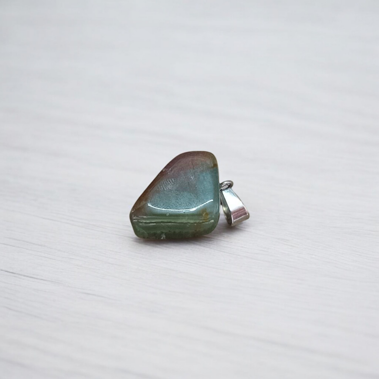 A natural Green Aventurine (African Green Jade) pendant with a polished finish, attached to a metal chain—ideal for men and women’s spiritual wear