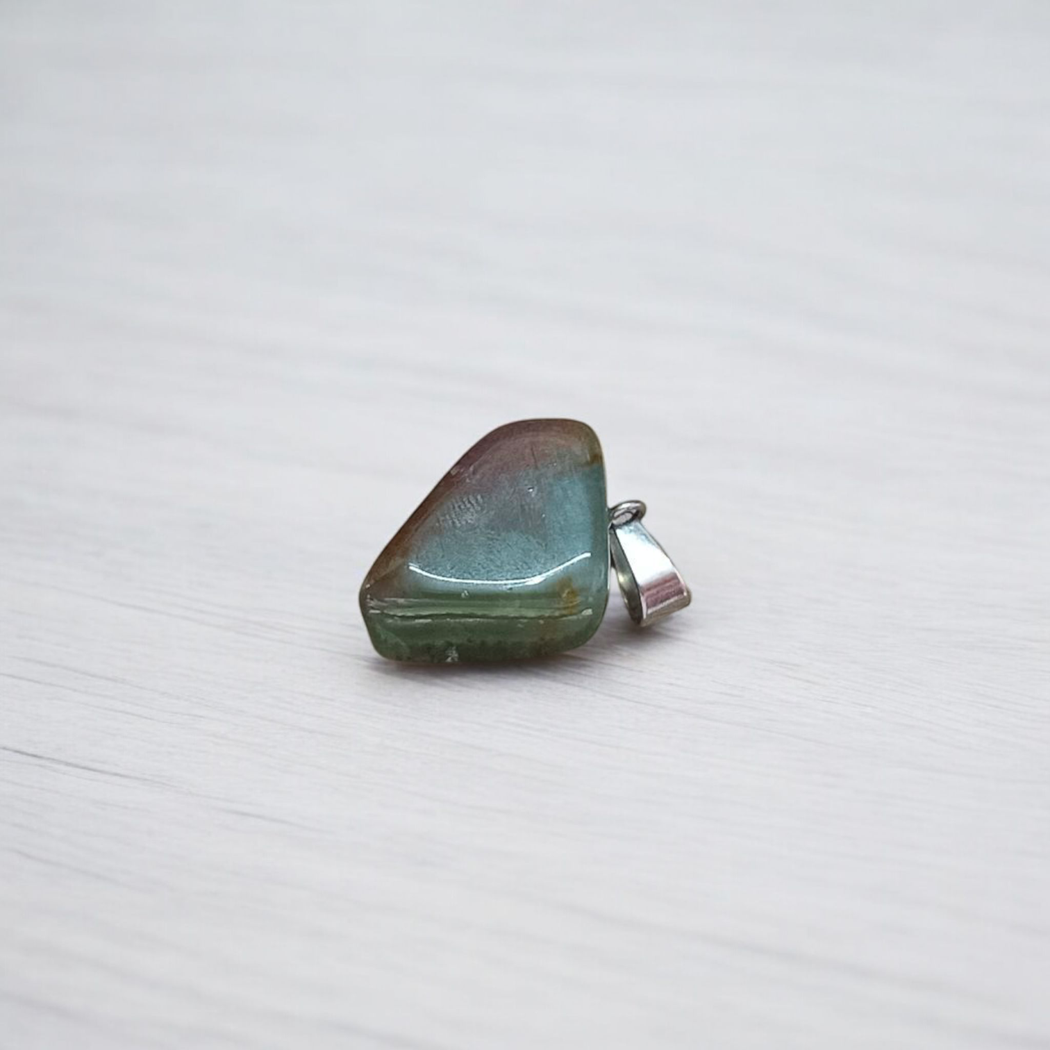A natural Green Aventurine (African Green Jade) pendant with a polished finish, attached to a metal chain—ideal for men and women’s spiritual wear