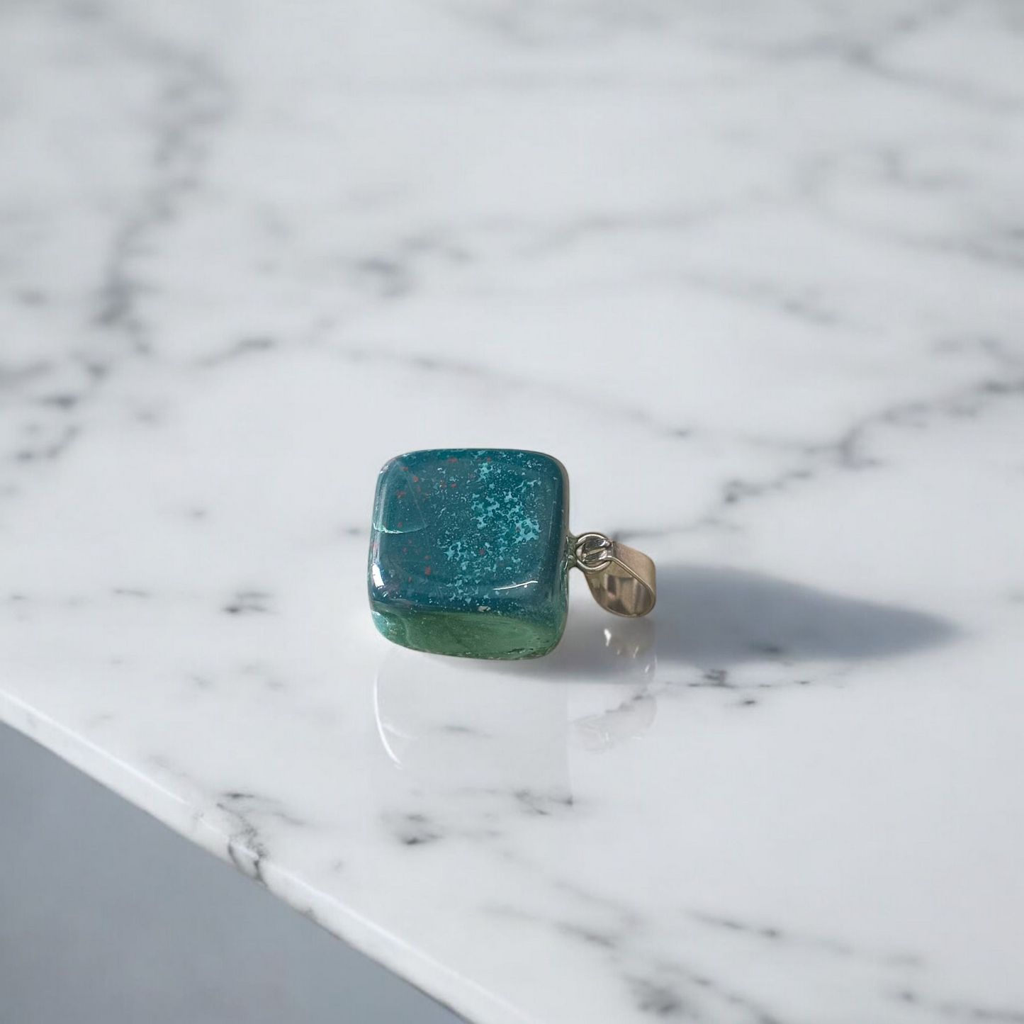 A natural Green Aventurine (African Green Jade) pendant with a polished finish, attached to a metal chain—ideal for men and women’s spiritual wear