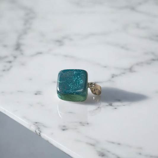 A natural Green Aventurine (African Green Jade) pendant with a polished finish, attached to a metal chain—ideal for men and women’s spiritual wear