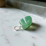 A natural Green Aventurine (African Green Jade) pendant with a polished finish, attached to a metal chain—ideal for men and women’s spiritual wear