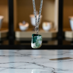 A natural Green Aventurine (African Green Jade) pendant with a polished finish, attached to a metal chain—ideal for men and women’s spiritual wear