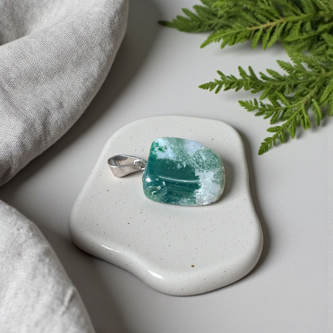 A natural Green Aventurine (African Green Jade) pendant with a polished finish, attached to a metal chain—ideal for men and women’s spiritual wear