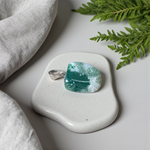 A natural Green Aventurine (African Green Jade) pendant with a polished finish, attached to a metal chain—ideal for men and women’s spiritual wear