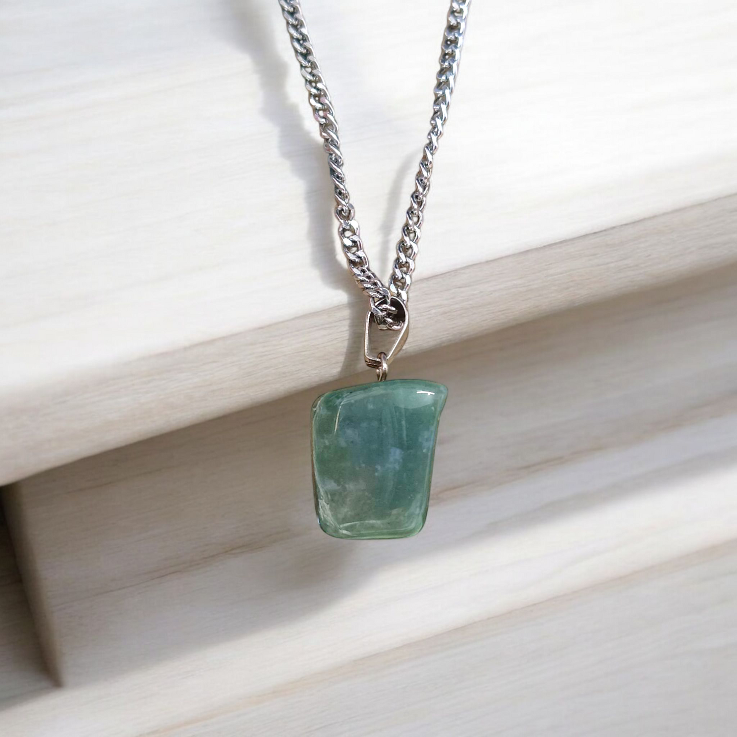A natural Green Aventurine (African Green Jade) pendant with a polished finish, attached to a metal chain—ideal for men and women’s spiritual wear