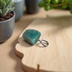 A natural Green Aventurine (African Green Jade) pendant with a polished finish, attached to a metal chain—ideal for men and women’s spiritual wear