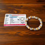 A natural Tulsi and Sphatik crystal bracelet with 8mm beads, handcrafted on stretchable cord, used for meditation and spiritual practice