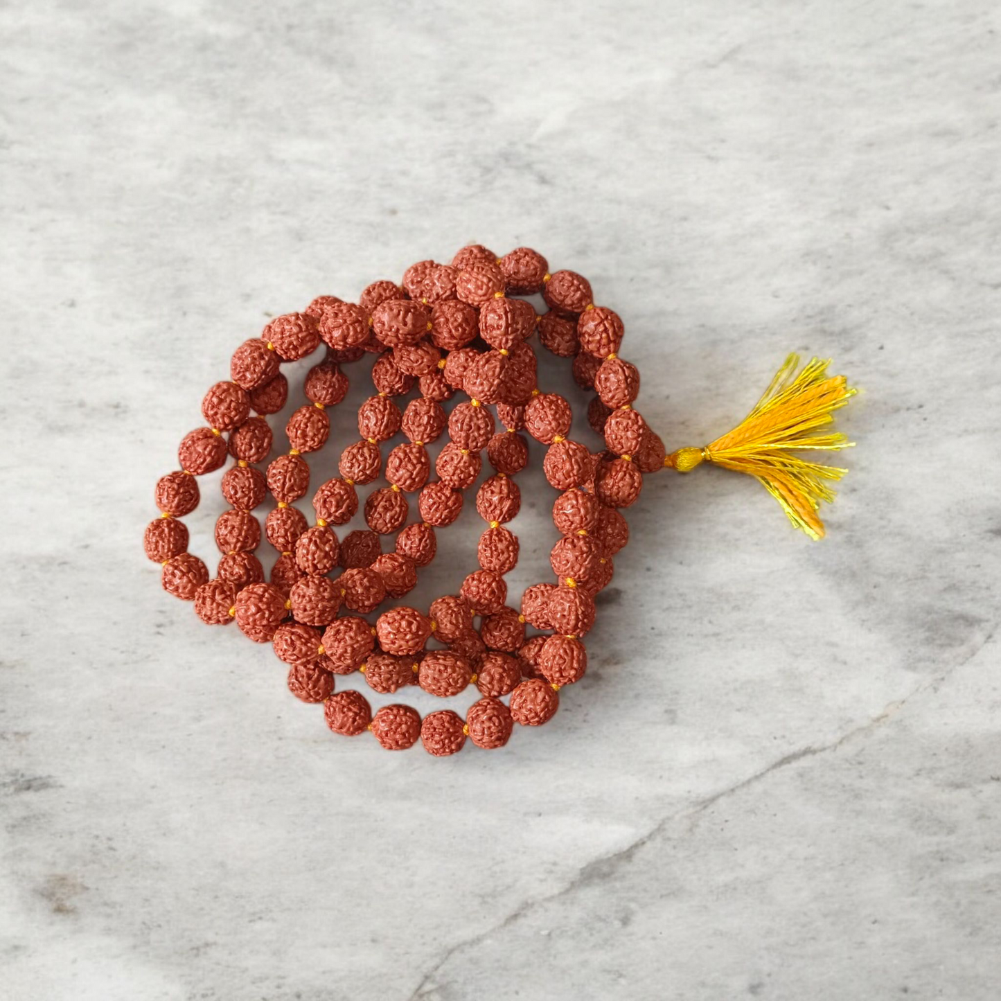 A spiritual combo featuring a 5 Mukhi Rudraksha Mala, a red velvet Pooja Aasan with golden border, and a traditional Gomukhi Japa Bag – all lab certified