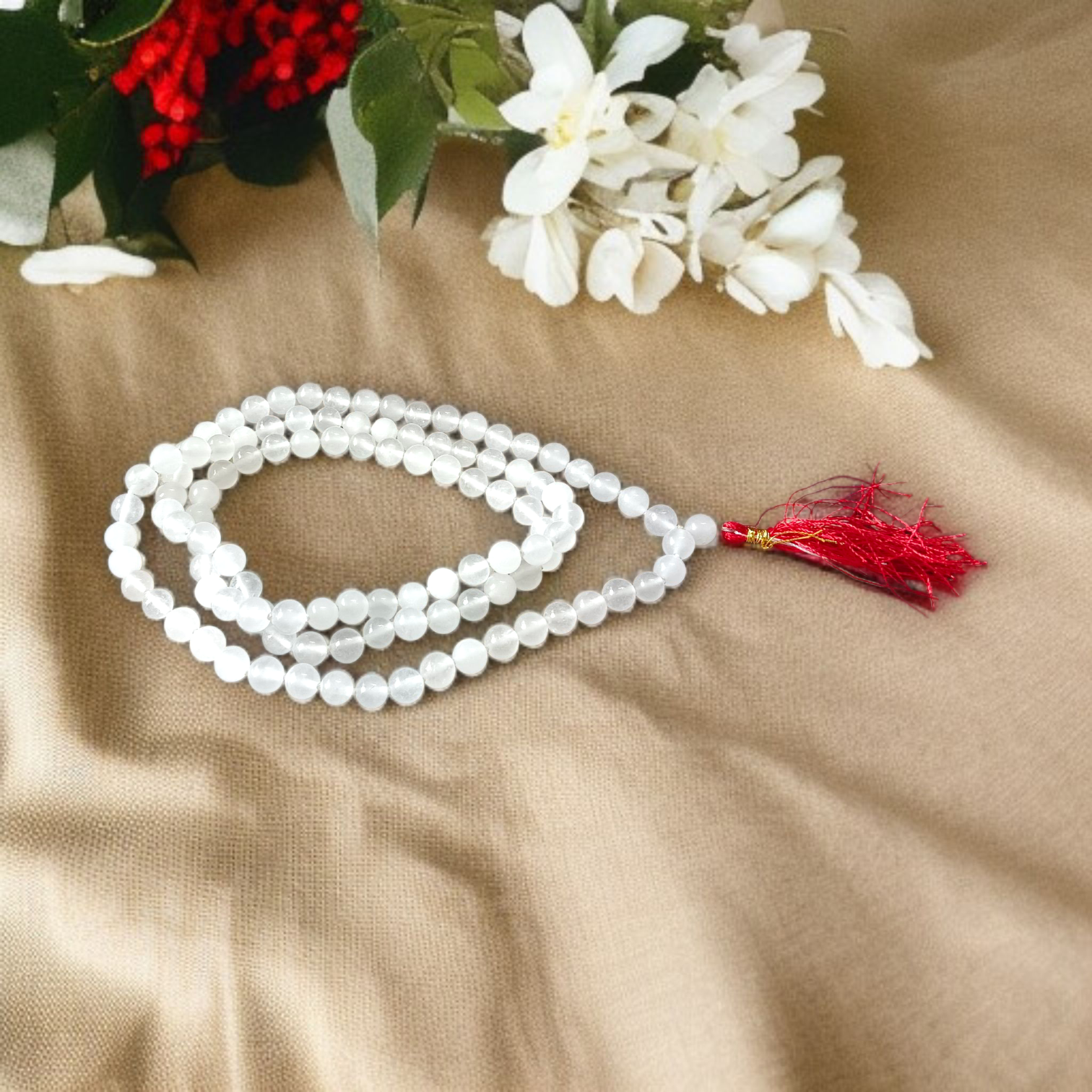 A spiritual combo of Sphatik Mala and Rudraksha Mala placed together, showing the clear quartz beads and brown Rudraksha seeds in detailed view