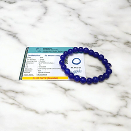 A stretchable Blue Onyx bracelet made of 8mm round beads, arranged neatly in a circular form on a clean white background
