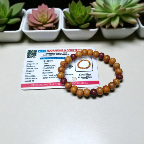 A stretchable bracelet made of alternating white and red 8mm sandalwood beads, displayed on a neutral background