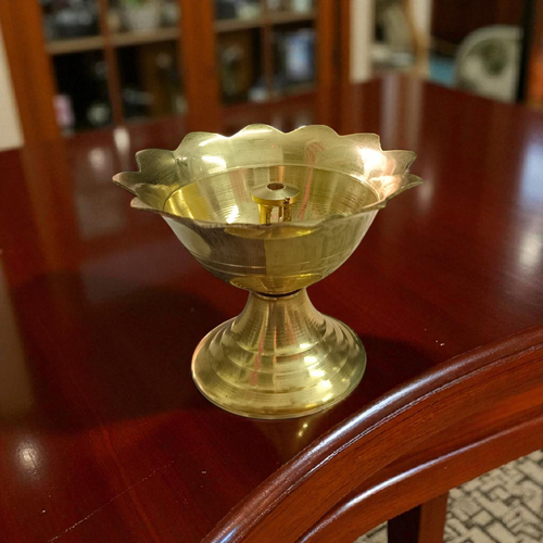 A traditional Panch Mukhi Jyot made of pure brass, featuring five oil chambers, intricately handcrafted for spiritual rituals and puja use