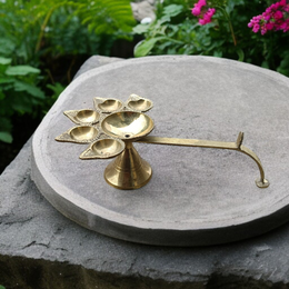 A traditional Panch Mukhi Jyot made of pure brass, featuring five oil chambers, intricately handcrafted for spiritual rituals and puja use