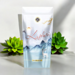 A zipper pouch of Kasturi-scented Agarbatti sticks with sleek black packaging and natural incense sticks beside it