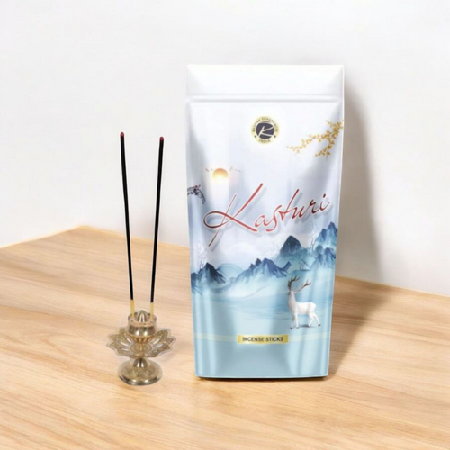 A zipper pouch of Kasturi-scented Agarbatti sticks with sleek black packaging and natural incense sticks beside it