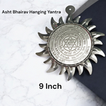 Ashtbhairav Yantra with gold finish and black thread for hanging, displayed against a white background
