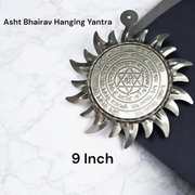 Ashtbhairav Yantra with gold finish and black thread for hanging, displayed against a white background