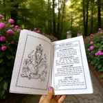 Bhajan Sandhya Hindi Book with vibrant devotional cover placed near diya and flowers in a worship setting