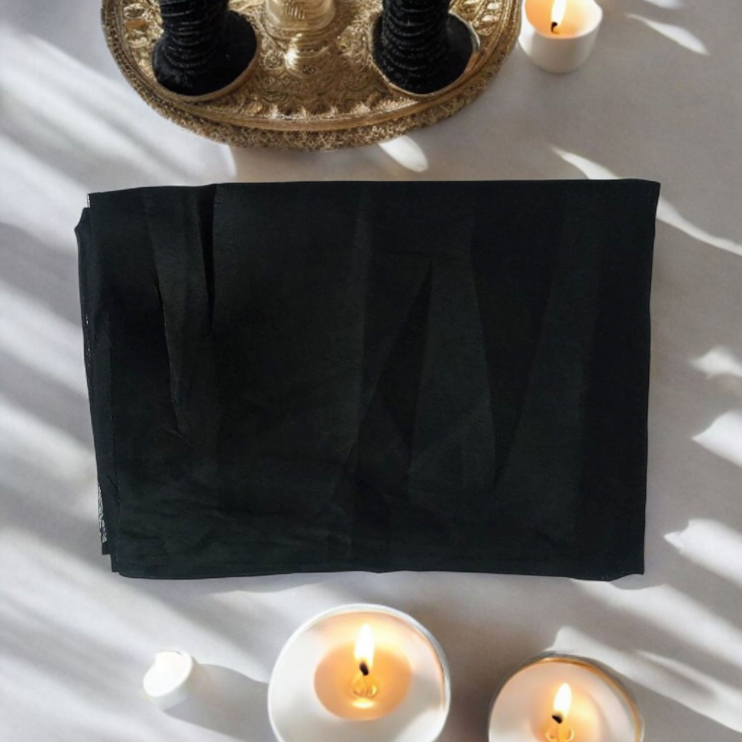 Black cotton pooja cloth (1.25 meter) neatly folded, ideal for spiritual rituals and deity worship