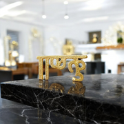 Brass Krishna Tilak stamp with wooden handle designed for precise forehead application during Hindu rituals and worship ceremonies