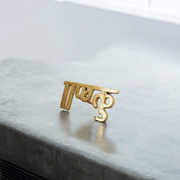 Brass Krishna Tilak stamp with wooden handle designed for precise forehead application during Hindu rituals and worship ceremonies